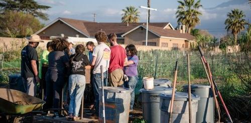 Students work at Huerta del Valle Community Garden